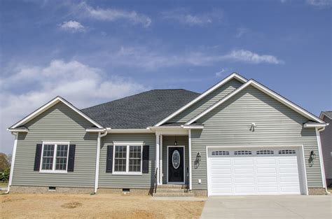 sage green house black shutters